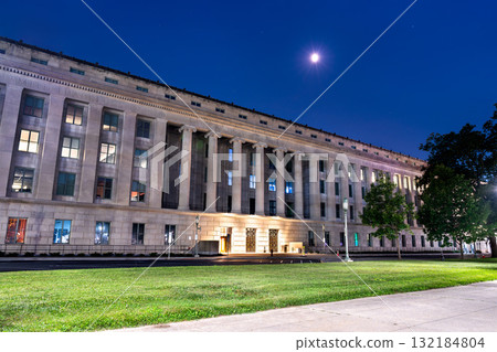 The Forum Building, home to the State Library of Pennsylvania, in Harrisburg, USA. This historic Capitol Complex landmark is illuminated under the moon at night 132184804