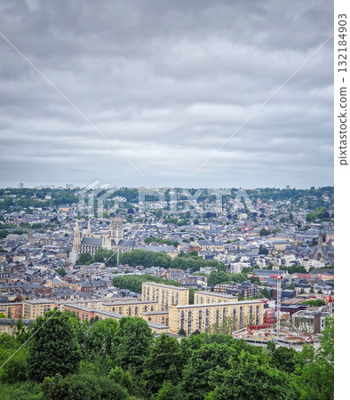 Rouen city in France under a cloudy sky, shot from the hill Sainte-Catherine with view to Saint-Ouen Abbey 132184903