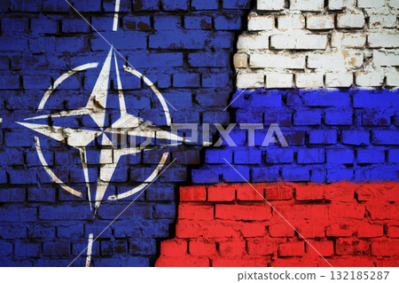 Kyiv, Ukraine - 12.09.2021: Flags of NATO and Russia on the wall with big crack in the middle. Relationships between North Atlantic Treaty Organisation and Russia concept Kyiv, Ukraine - 12.09.2021: Flags of NATO and Russia on the wall with big crack in the middle. Relationships between North Atlantic Treaty Organisation and Russia concept 132185287