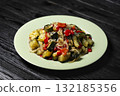 Healthy vegetarian meal with roasted vegetables on plate 132185356