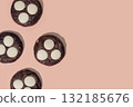 Chocolate cookies with white chocolate chips on a soft pastel background with copy space 132185676