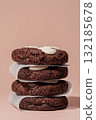 Stack of chocolate cookies with white chocolate chips on soft background with copy space 132185678
