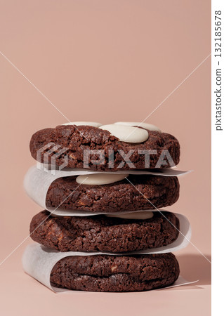 Stack of chocolate cookies with white chocolate chips on soft background with copy space 132185678