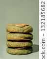 Stack of green cookies with golden topping on a soft background featuring copy space 132185682