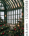 Festive Christmas background with decorated trees and sparkling lights in a cozy indoor setting 132185688
