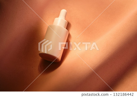 Bottles of facial serum in the soft sunset light. Bottles of facial serum in the soft sunset light. 132186442