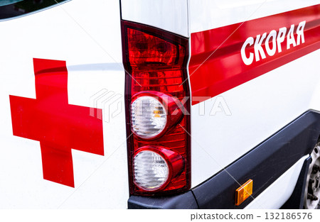 Ambulance car. Text in Russian: Emergency medical care 132186576