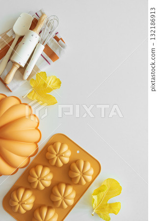 Autumn Baking Setup with Pumpkin Mold, Frosting and Seasonal Decorations Autumn Baking Setup with Pumpkin Mold, Frosting and Seasonal Decorations 132186913