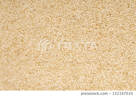 Sesame Seed Texture. Closeup of scattered sesame seeds Sesame Seed Texture. Closeup of scattered sesame seeds 132187010