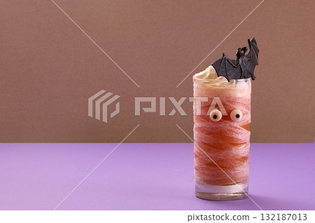 Spooky Halloween Drink. Mummy-themed drinks with whipped cream 132187013