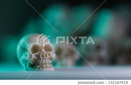 Miniature skulls background. Skull background 132187419