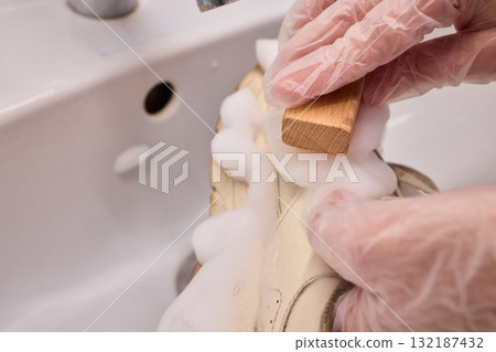 The Process of Cleaning Your Sneakers Using Foam and Gloves in a Sink for Best Results The Process of Cleaning Your Sneakers Using Foam and Gloves in a Sink for Best Results 132187432