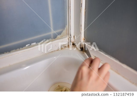 When embarking on home renovation, applying caulk with a putty knife is an essential skill 132187459