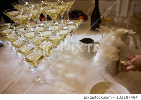 An Elegant Cocktail Display featuring Fog and Bubbles creates an enchanting atmosphere An Elegant Cocktail Display featuring Fog and Bubbles creates an enchanting atmosphere 132187484