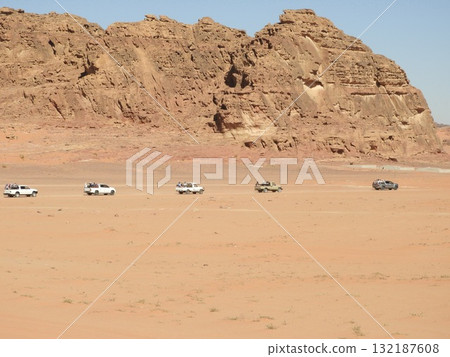 A convoy of off-road vehicles in desert A convoy of off-road vehicles in desert 132187608