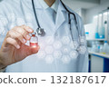 Doctor holding vial with digital health icons in modern lab. 132187617