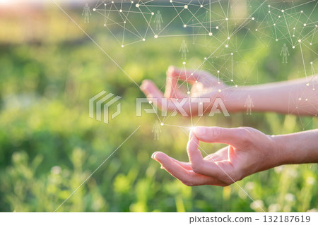 Hands connect with nature through mindful meditation practice. Hands connect with nature through mindful meditation practice. 132187619