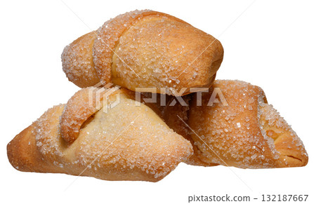 A stack of baked croissants sprinkled with coarse sugar A stack of baked croissants sprinkled with coarse sugar 132187667
