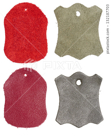 Four isolated samples of genuine leather tags with a hole Four isolated samples of genuine leather tags with a hole 132187703