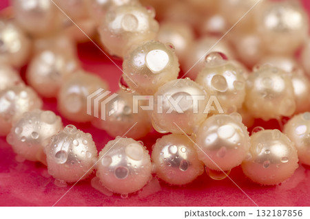 wet natural unpolished irregular shaped pearls from a marine mollusk covered with water droplets used in the manufacture of women's jewelry beads wet natural unpolished irregular shaped pearls from a marine mollusk covered with water droplets used in the manufacture of women's jewelry beads 132187856