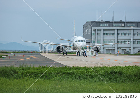 A passenger plane preparing to take off at Yonago Airport A passenger plane preparing to take off at Yonago Airport 132188839