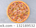 Cheeseburger Style Pizza with Pickles, Red Onion, Ground Beef, Crispy Onions and Mustard Drizzle on Gray Background 132189532