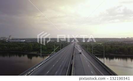 Aerial view of highway bridge traffic over a river at sunset. Clip Aerial view of highway bridge traffic over a river at sunset. Clip 132190341