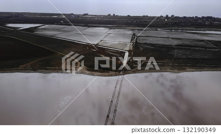 Aerial view flying over pink salt lake and evaporation ponds. Media Aerial view flying over pink salt lake and evaporation ponds. Media 132190349