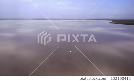 Drone flying above a beautiful pink lake. Media 132190413