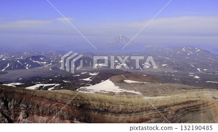 Aerial view flying over mutnovsky volcano crater in kamchatka. Media Aerial view flying over mutnovsky volcano crater in kamchatka. Media 132190485
