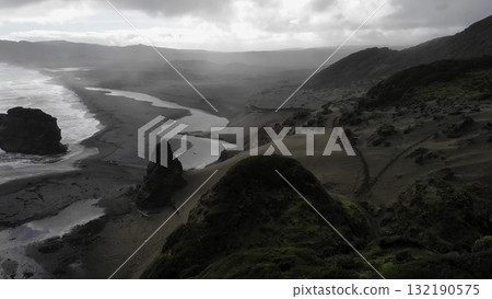 Whatipu beach wild coastline meeting tasman sea in new zealand 132190575