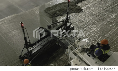Laser screed machine pouring and leveling concrete floor. Clip Laser screed machine pouring and leveling concrete floor. Clip 132190627