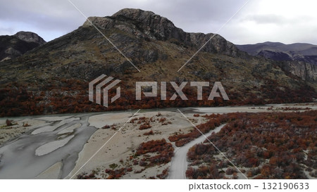 Autumnal red trees in patagonian mountain valley. Media 132190633