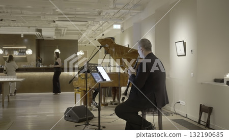 Professional clarinetist playing music at live concert. Creative 132190685