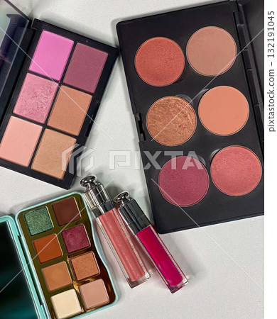 Makeup Flat Lay with Blush Palettes, Eyeshadows and Lip Gloss Makeup Flat Lay with Blush Palettes, Eyeshadows and Lip Gloss 132191045