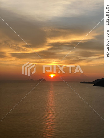 Golden Sunset over the Sea Horizon with Islands 132191105