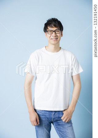 A man wearing a T-shirt 132191450