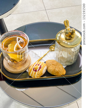 Elegant Tea and Pastry Serving on Table Elegant Tea and Pastry Serving on Table 132191500