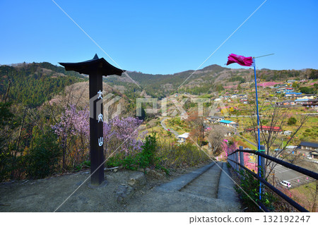 View from the observation deck of Hanamomo no Sato, a rural mountain area in early spring, Higashichichibu Village 132192247