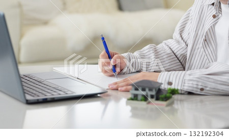 Asian man studying real estate Asian man studying real estate 132192304