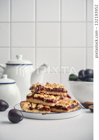 Traditional German Zwetschgenkuchen on white plate Traditional German Zwetschgenkuchen on white plate 132193952