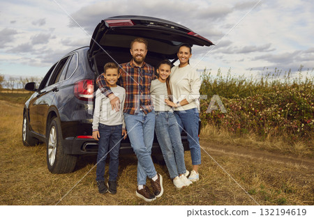 Full Length Portrait of a Family by the Traveling Car 132194619