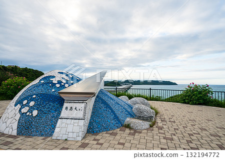 Waves crashing on the beautiful sandy beach of Tsunoshima and the Tsunoshima Bridge Waves crashing on the beautiful sandy beach of Tsunoshima and the Tsunoshima Bridge 132194772
