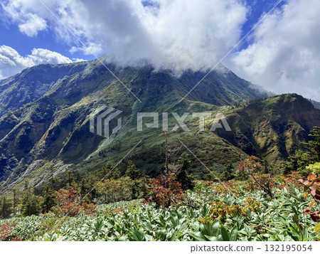 The marshland and boardwalk of Mt. Naeba, and the pond lit up by autumn leaves 132195054