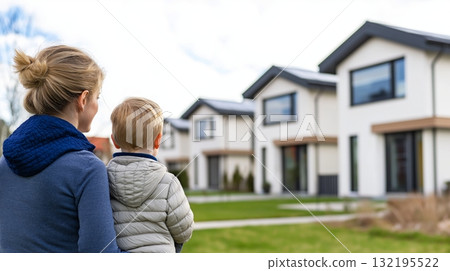 Caucasian Mother and child observing modern suburban homes Caucasian Mother and child observing modern suburban homes 132195522