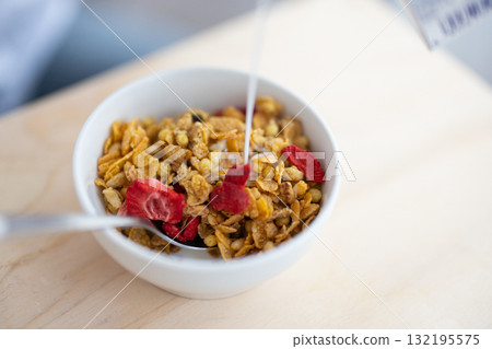 Cereal with dried fruit and milk Cereal with dried fruit and milk 132195575