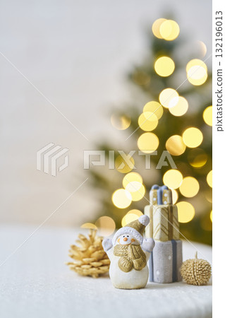 Snowman figurine and Christmas tree Christmas image 132196013