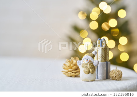 Snowman figurine and Christmas tree Christmas image 132196016