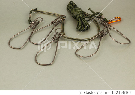 Metal traps and rope setup for outdoor activities in nature Metal traps and rope setup for outdoor activities in nature 132196165