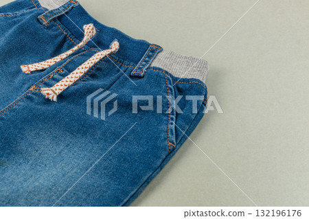 Comfortable denim shorts for children on a soft background 132196176